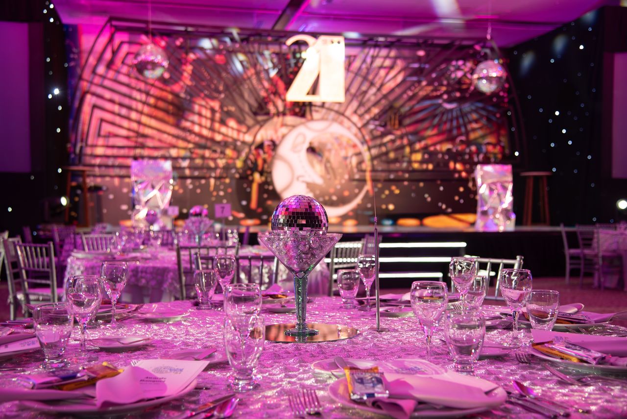 services-04 Luxurious dining setup for a 21st birthday party with a sparkling modern theme.